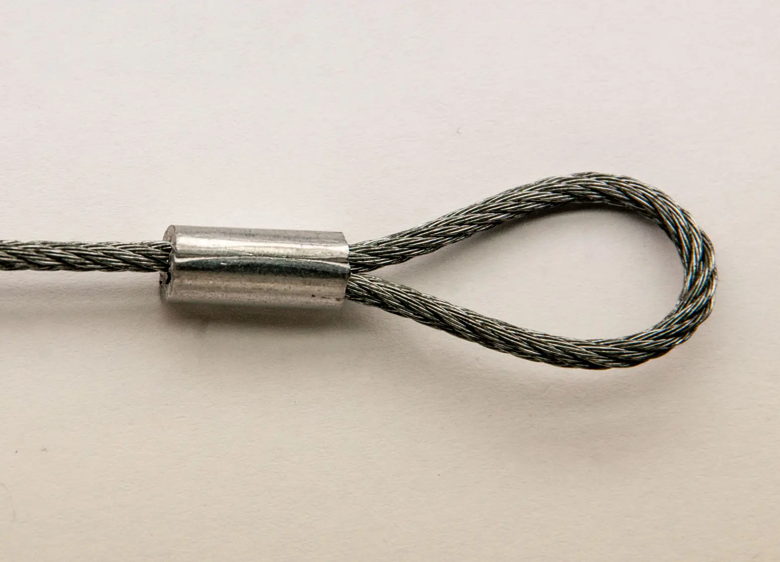 Loop Sleeve end fitting crimped on white background