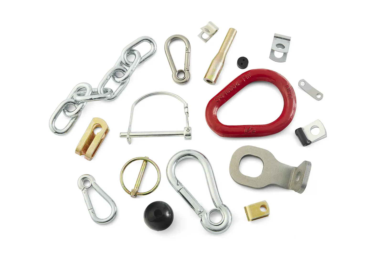Assortment of rigging and attachment hardware including carabiners and connectors on a light background.