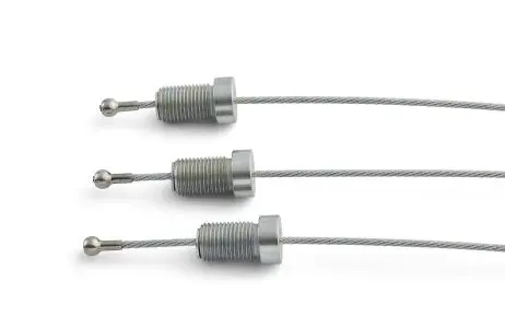 Cable ends Small pinning bolt cable assembly Close-up of multiple small cable assemblies with metal end fittings on a light background.