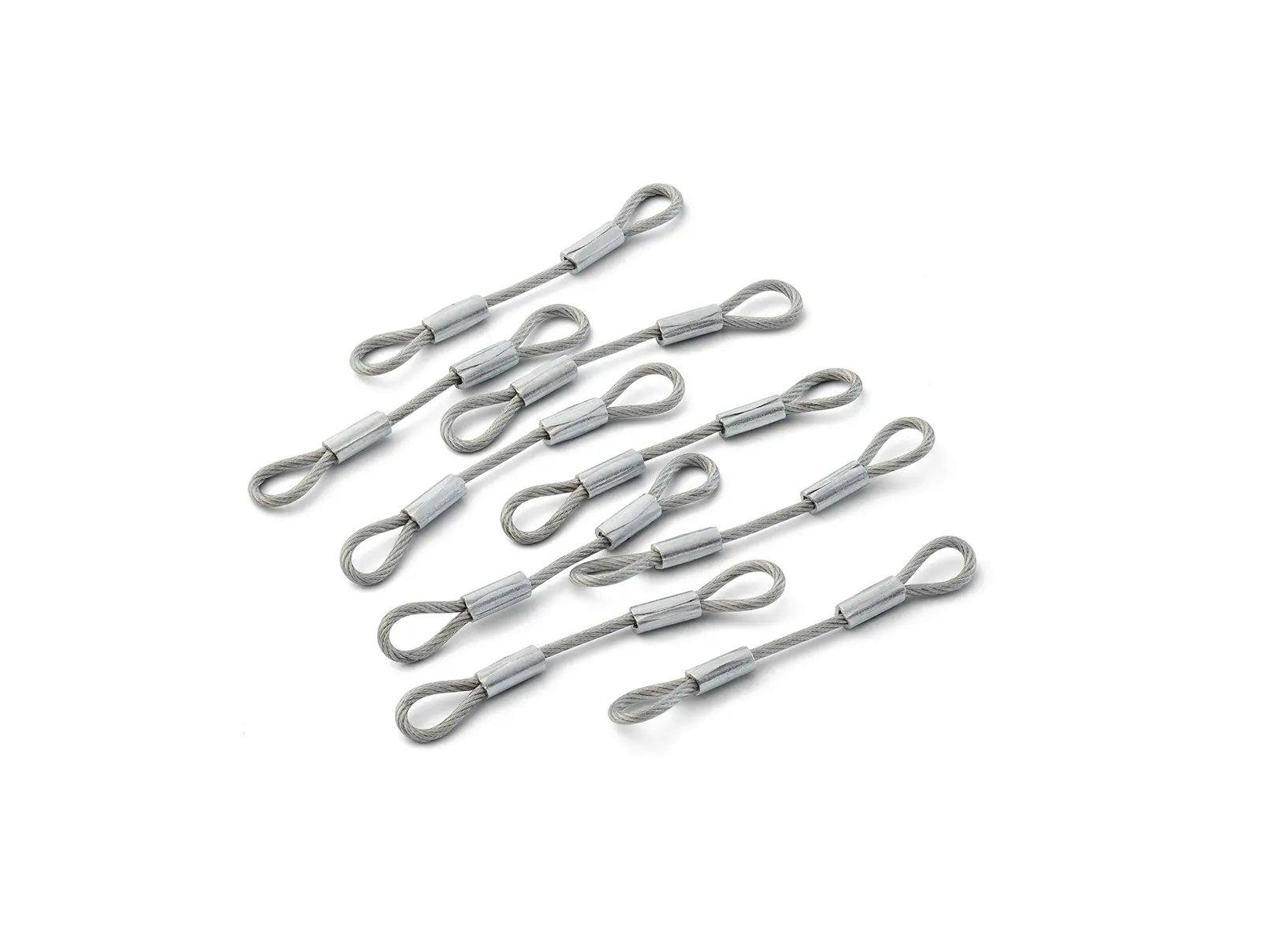 Small group of wire rope lanyard assemblies with looped ends on a light background.