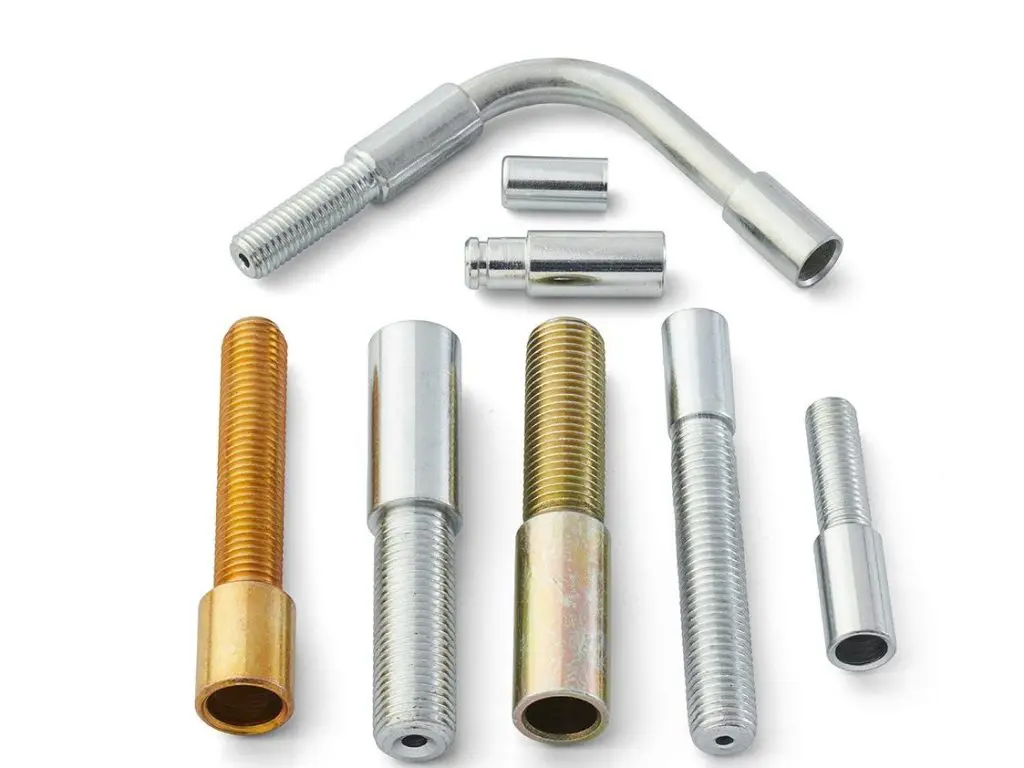 Group of threaded conduit and end components arranged on a light background. edited