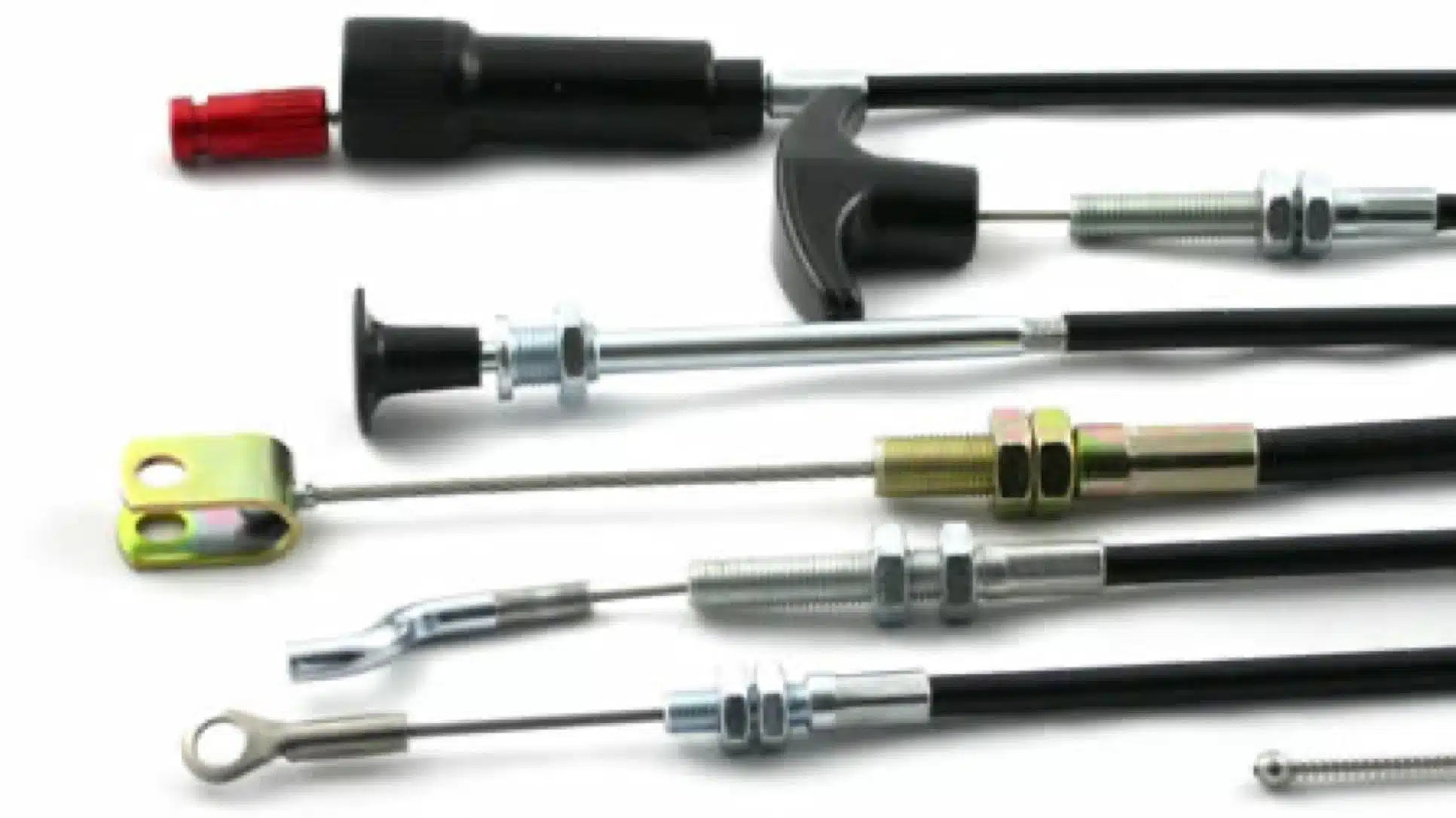 Assorted cables with different end fittings lined up on a white background.