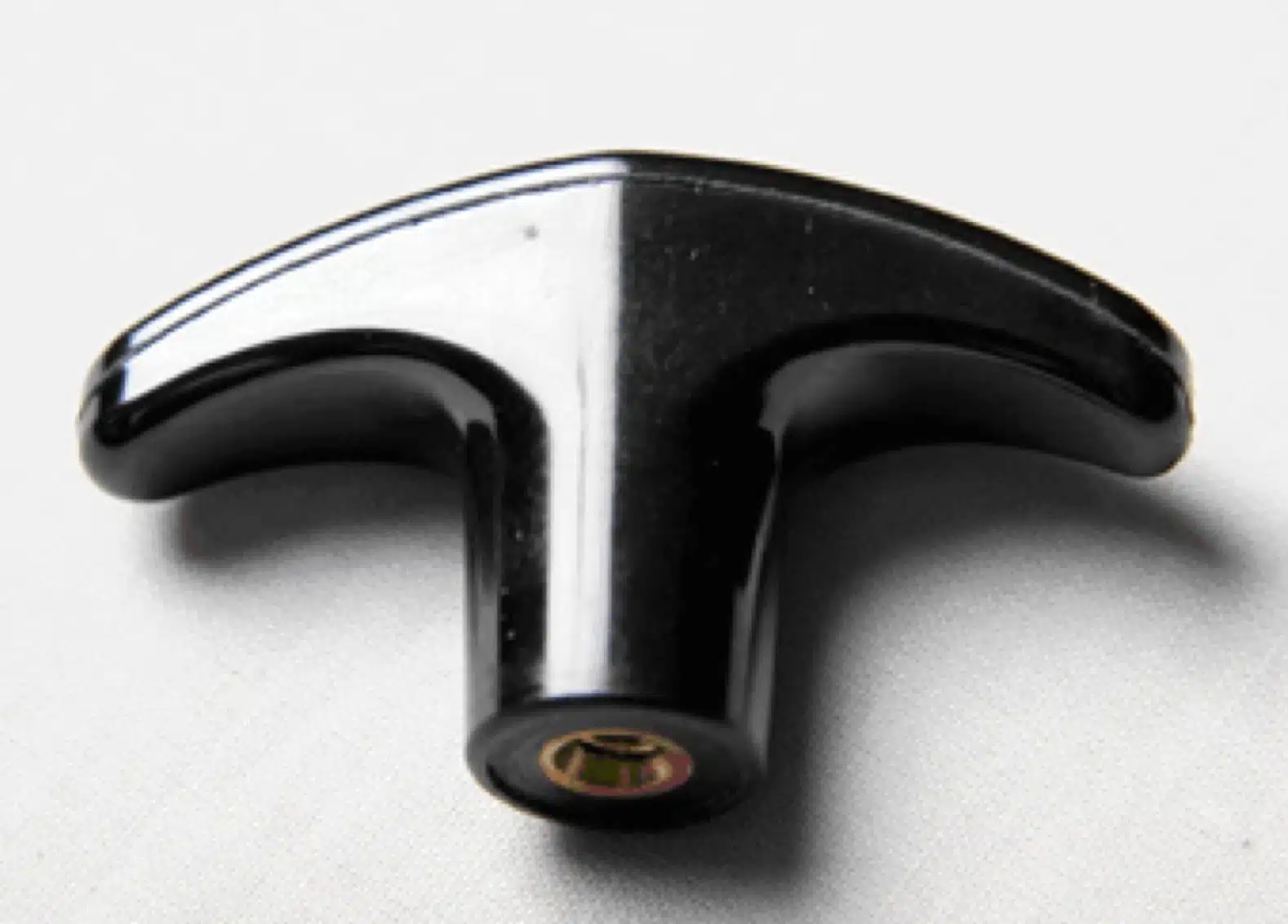 Handle and knob end fitting on white background.