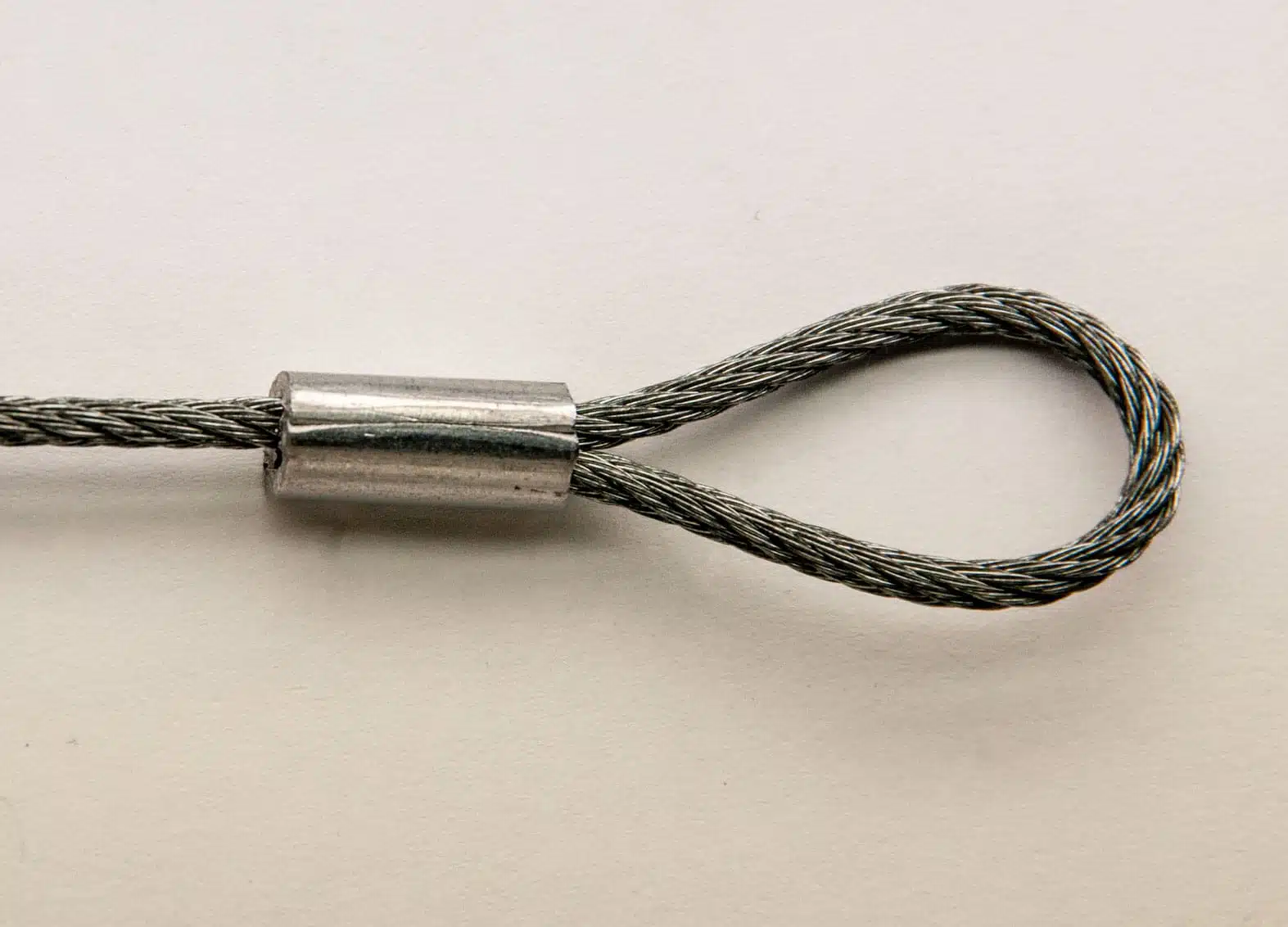 Loop Sleeve end fitting crimped on white background
