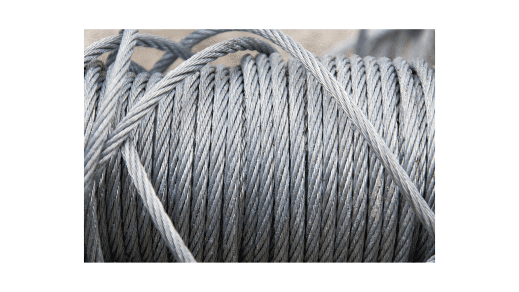 Uncoated bare steel wire rope close-up detailing the tightly braided strand construction for mechanical cable assemblies.