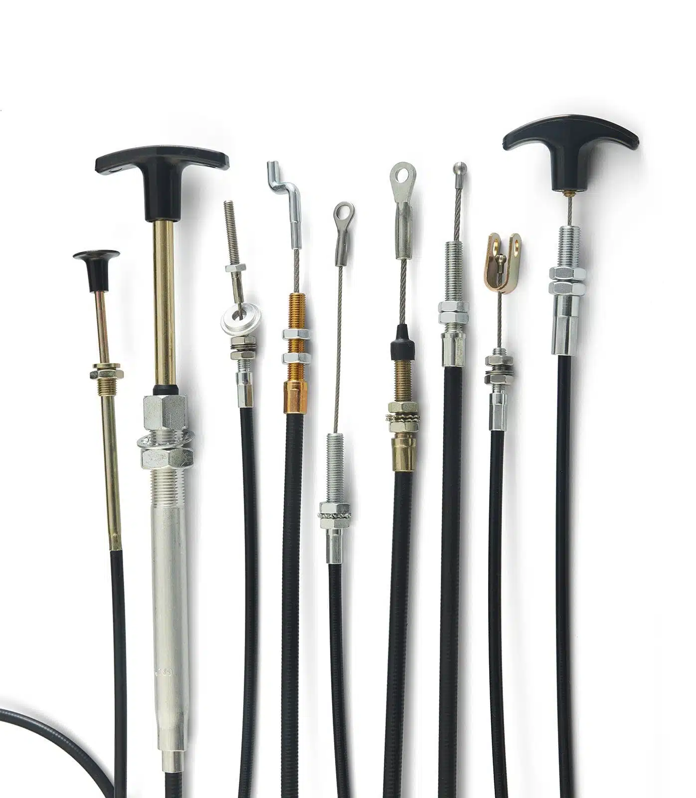 Multiple push-pull control cables lined up with different end fittings and handles.