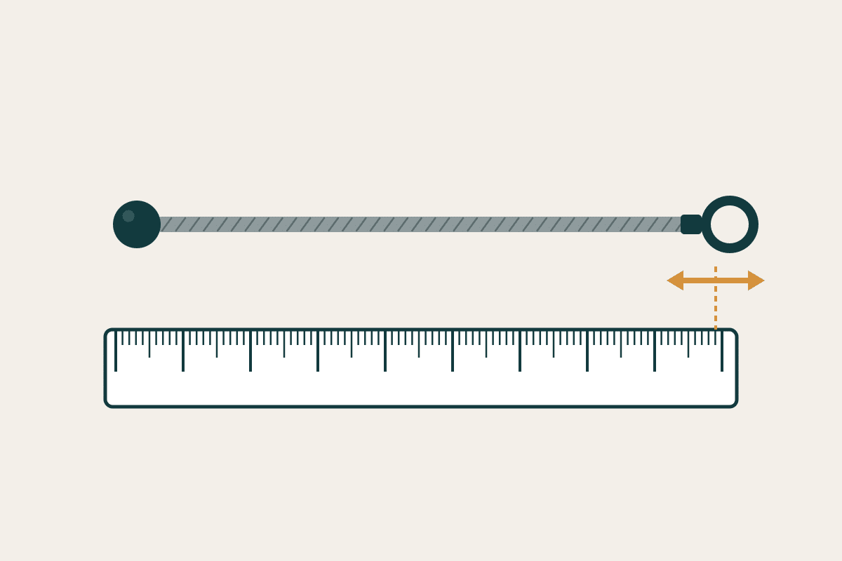 Wire rope assembly measured against a ruler showing a length tolerance